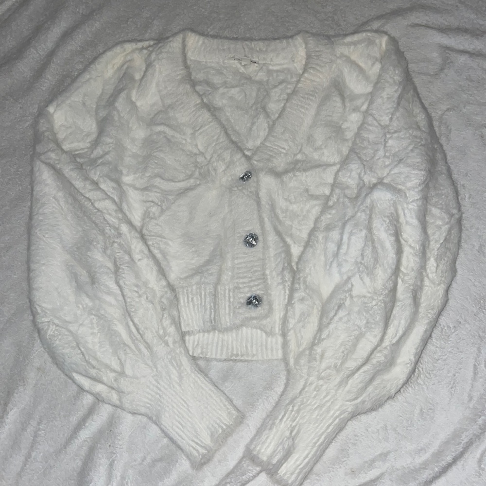 white puffy sweater